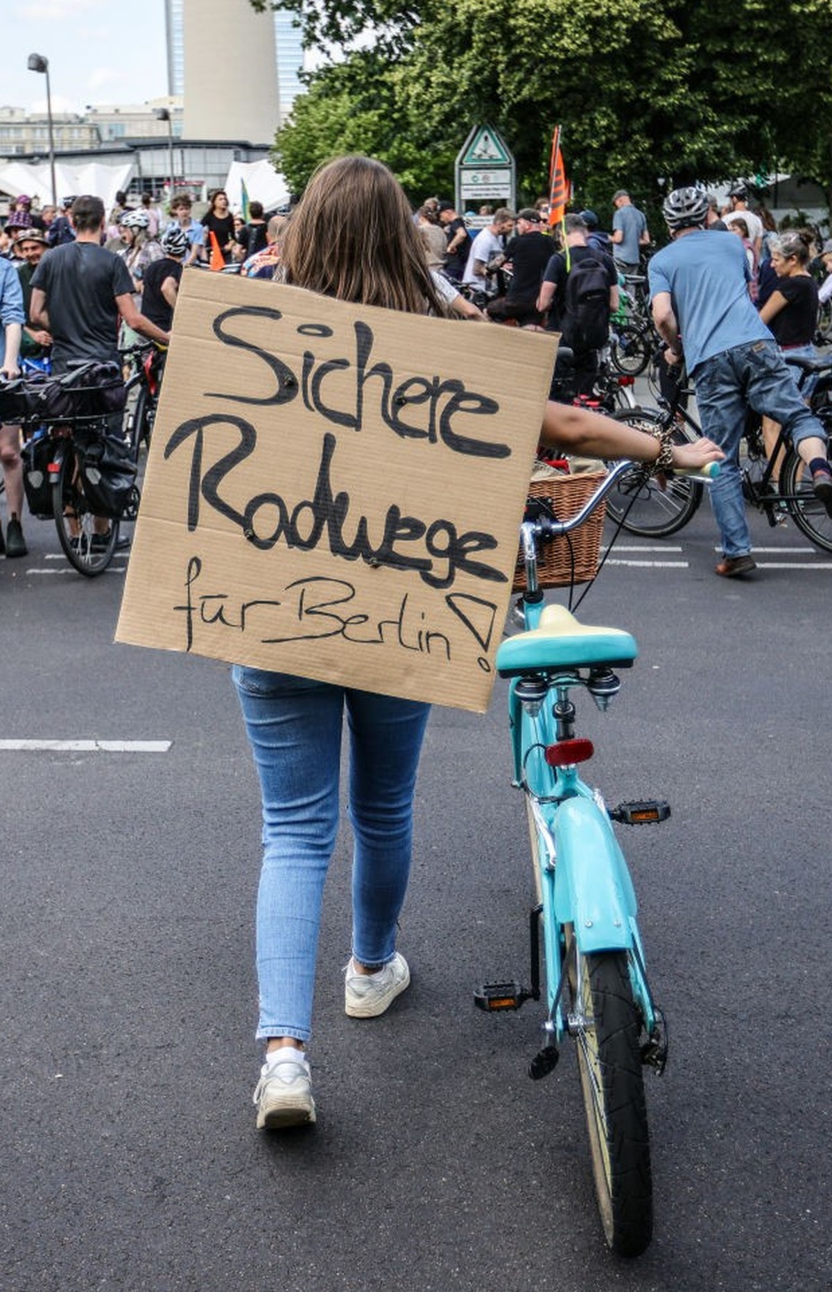 BERLIN, GERMANY - JULY 2: A demonstrator with a banner reading "Secure bike-lanes for Berlin" as activists protesting against the city government's halt on new bicycle lanes demonstrate ...