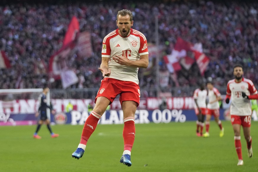 Bayern&#039;s Harry Kane celebrates after scoring his side&#039;s opening goal during the German Bundesliga soccer match between Bayern Munich and Heidenheim at the Allianz Arena stadium in Munich, Ge ...