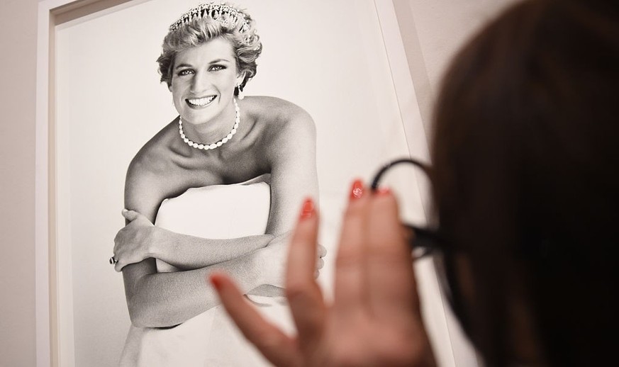 LONDON, ENGLAND - FEBRUARY 10: An image of Princess Diana is inspected at the press preview for &#039;Vogue 100: A Century of Style&#039; exhibiting the photographs that has been commissioned by Briti ...