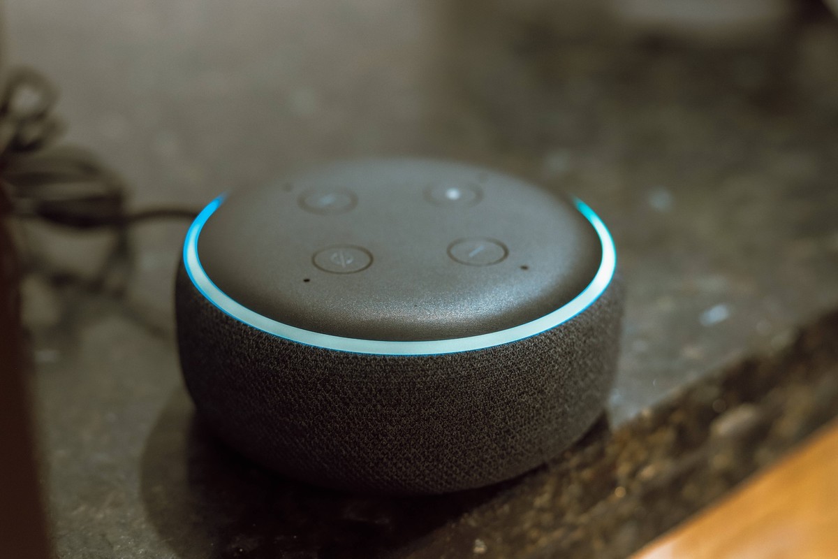 Photo illustration in Paraguay. In this photo illustration, Echo Dot smart speaker with working Alexa with blue light ring seen displayed. Amazon will soon launch a new, improved update for artificial ...