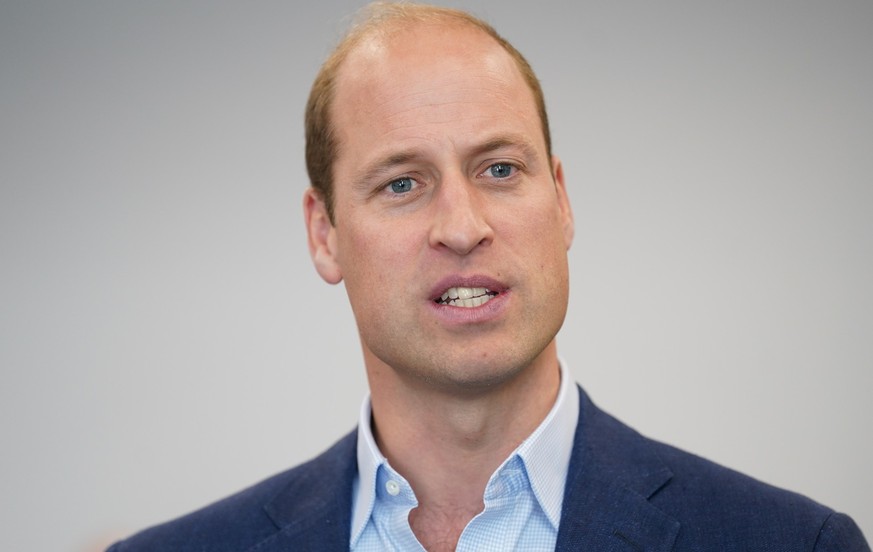 MILTON KEYNES, ENGLAND - OCTOBER 11: Prince William, Prince of Wales talks to staff during a visit to the Milton Keynes Blue Light Hub in Buckinghamshire, to highlight the importance of supporting the ...