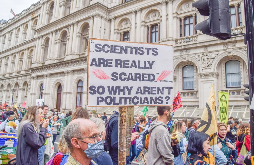 September 1, 2021, London, United Kingdom: A protester holds a placard which says Scientists Are Really Scared, So Why Aren t Politicians during the demonstration outside Downing Street..Extinction Re ...