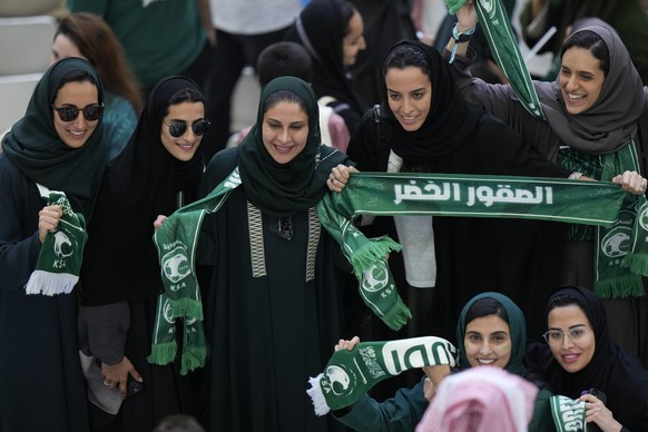 FILE - Saudi women supporters celebrate after Saudi Arabia won the World Cup group C soccer match between Argentina and Saudi Arabia at the Lusail Stadium in Lusail, Qatar, on Nov. 22, 2022. For a bri ...