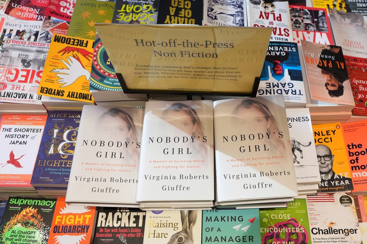 The memoir book of Virginia Giuffre, &quot;Nobody&#039;s Girl&quot; is seen amongst other books in a store and is up for sale in London, Tuesday, Oct. 21, 2025 six months after Giuffre died by suicide ...