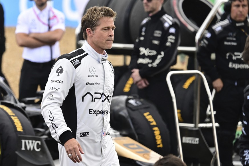 FILE - Actor Brad Pitt walks through the paddock before the British Formula One Grand Prix race at the Silverstone racetrack, Silverstone, England, Sunday, July 9, 2023. The Rolex 24 at Daytona is the ...