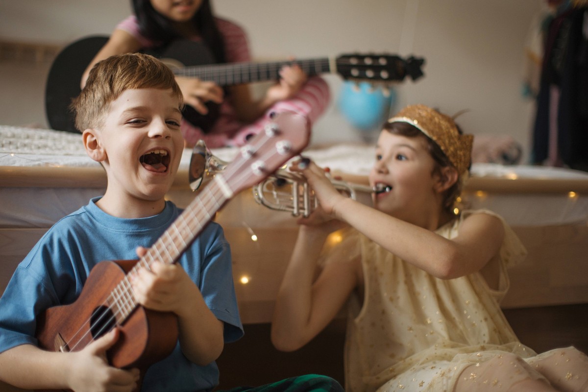 Happy three friends playing on a musical instuments. Happy three friends playing on the musical instuments. model released Copyright: xx HHH KIDS WORLD 2023 HHH 135.jpeg