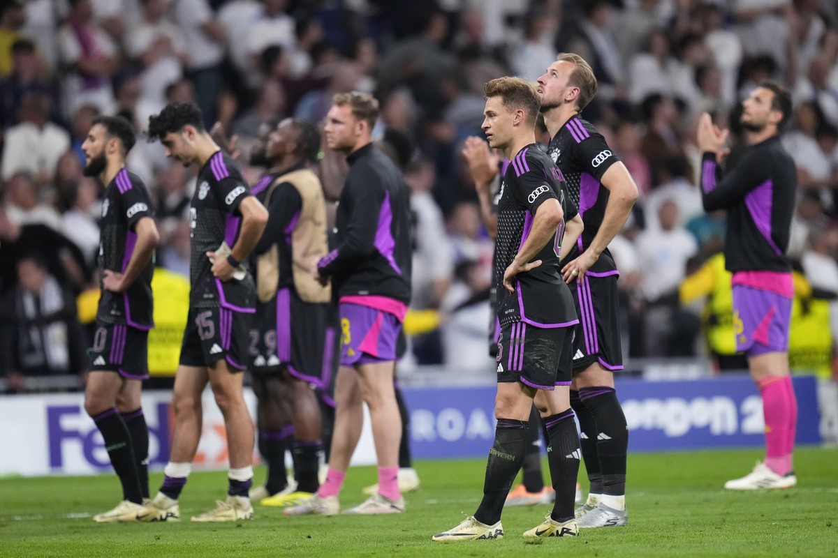 Bayern Munich players react at the end of the Champions League semifinal second leg soccer match between Real Madrid and Bayern Munich at the Santiago Bernabeu stadium in Madrid, Spain, Wednesday, May ...