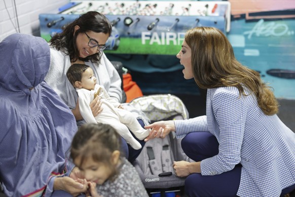 Britain&#039;s Kate, Princess of Wales, meets a mother and baby during a visit to the Windsor Family Hub on Tuesday, June 6, 2023 in Windsor, England. (Chris Jackson, Pool via AP)