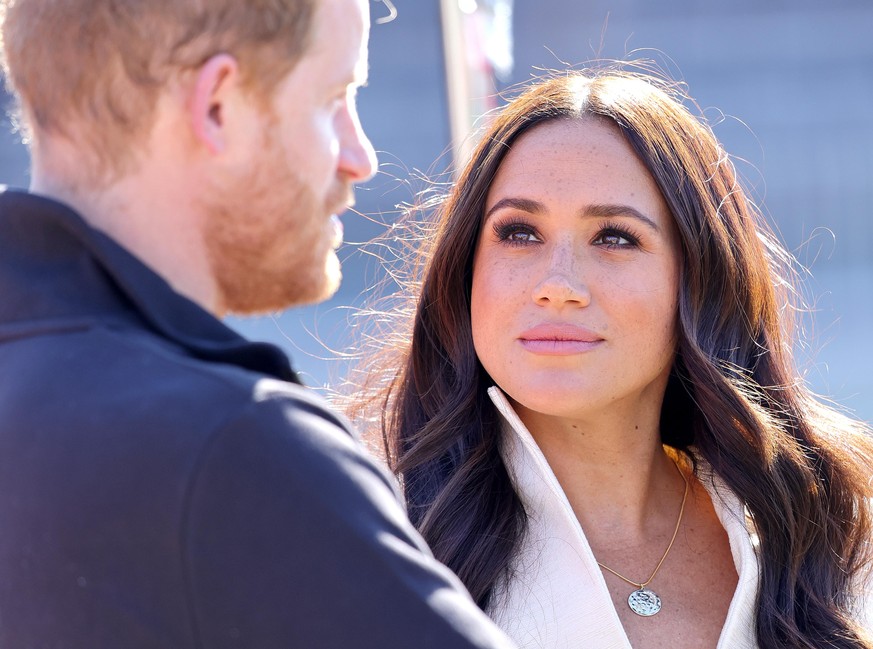 THE HAGUE, NETHERLANDS - APRIL 17: Prince Harry, Duke of Sussex and Meghan, Duchess of Sussex attend the Athletics Competition during day two of the Invictus Games The Hague 2020 at Zuiderpark on Apri ...