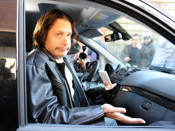 MANNHEIM, GERMANY - SEPTEMBER 06: German comedian Oliver Pocher, dressed up as Joerg Kachelmann, is pictured in a car outside the district court on day one of the trial against the tv host and weather ...
