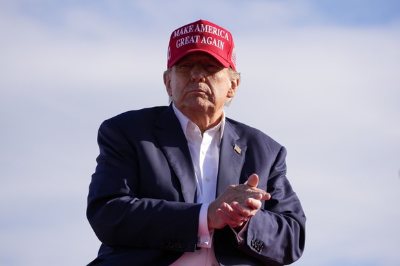 Republican presidential candidate former President Donald Trump applauds at a campaign rally Saturday, March 16, 2024, in Vandalia, Ohio. (AP Photo/Jeff Dean)