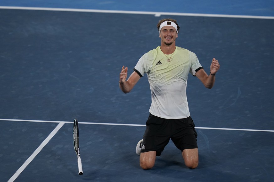 Alexander Zverev, of Germany, reacts after defeating Karen Khachanov, of the Russian Olympic Committee, in the men&#039;s single gold medal match of the tennis competition at the 2020 Summer Olympics, ...