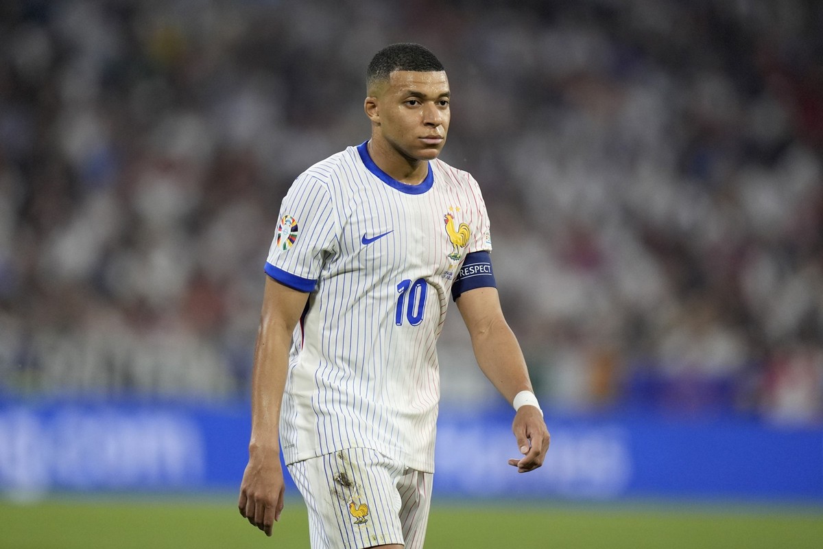 Kylian Mbappe of France walks on the pitch during a semifinal match between Spain and France at the Euro 2024 soccer tournament in Munich, Germany, Tuesday, July 9, 2024. (AP Photo/Matthias Schrader)