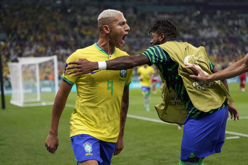 Brazil's Richarlison celebrates after scoring the opening goal during the World Cup group G soccer match between Brazil and Serbia, at the Lusail Stadium in Lusail, Qatar, Thursday, Nov. 24, 2022. (AP ...
