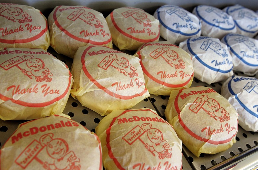 DES PLAINES, IL - APRIL 14: A wrapped cheeseburger and hamburger display sits inside the McDonald&#039;s USA First Store Museum April 14, 2005 in Des Plaines, Illinois. The McDonald&#039;s museum is a ...