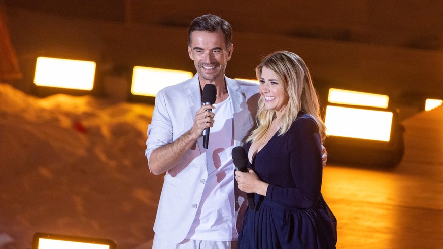 GELSENKIRCHEN, GERMANY - JULY 09: Florian Silbereisen and Beatrice Egli are seen on stage during the TV show &quot;Die grosse Schlagerstrandparty 2022&quot; on July 09, 2022 in Gelsenkirchen, Germany. ...
