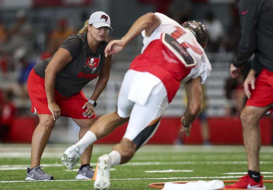 July 29, 2019, Tampa, Florida, USA: Tampa Bay Buccaneers assistant defensive line coach Lori Locust watches Tampa Bay Buccaneers wide receiver Justin Watson (17) run drills during training camp at the ...