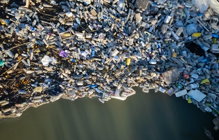 Aerial shot view waterfront scrap-heap pile plastic bottles rubbish outdoor. Pollution debris on lakeshore. Global damage, environmental pollution concept. Costa Blanca. Guardamar del Segura. Spain || ...