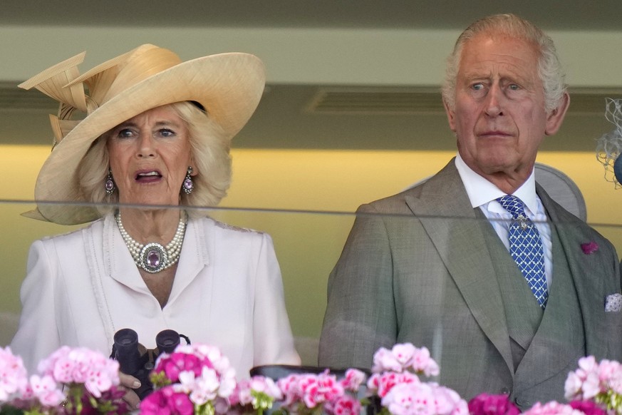 Britain&#039;s King Charles III and Camilla, the Queen Consort react to their horse racing at day two of the Royal Ascot horse racing meeting, at Ascot Racecourse in Ascot, England, Wednesday, June 21 ...