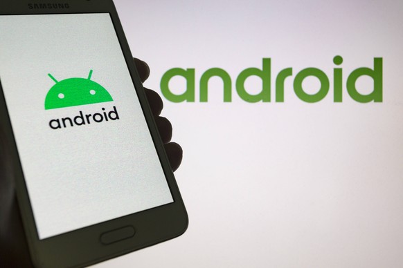 August 24, 2019, Asuncion, Paraguay: Updated logo of Android, a mobile operating system developed by Google, new wordmark with robot lock-up are seen on a smartphone screen against the Android old log ...