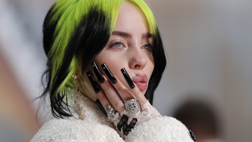 FILE - In this Feb. 9, 2020, file photo, singer Billie Eilish arrives at the Oscars in Los Angeles. Billie Eilish scored 12, 2020 Billboard Music Awards nominations, dick clark productions and NBC ann ...