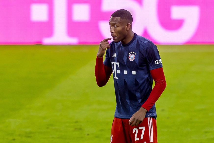 FC Bayern Muenchen vs. BV Borussia Dortmund - 1. Bundesliga Muenchen, Deutschland, 06.03.2021: David Alaba Bayern Munich schaut bei dem Spiel der 1. Bundesliga zwischen FC Bayern Muenchen und BV Borus ...