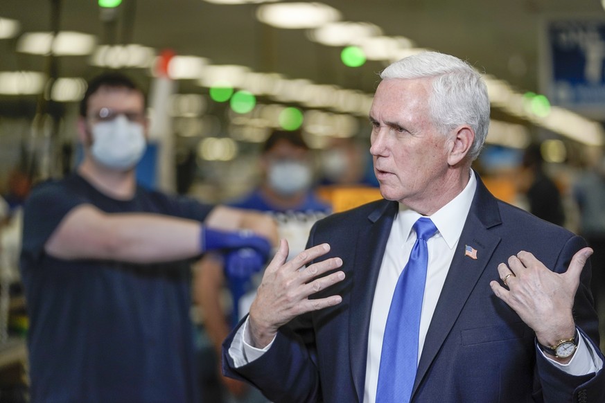 Vice President Mike Pence visits the GE Healthcare manufacturing facility Tuesday April 21, 2020, in Madison, Wis. (AP Photo/Morry Gash)