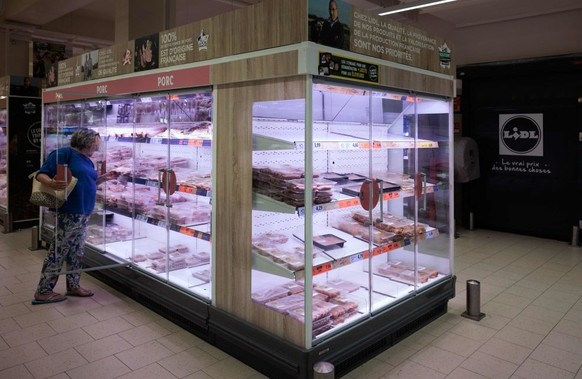 A customer shops in the meat aisle of a Lidl discount supermarket, in Chatenay-Malabry, on May 31, 2023. (Photo by JOEL SAGET / AFP) (Photo by JOEL SAGET/AFP via Getty Images)