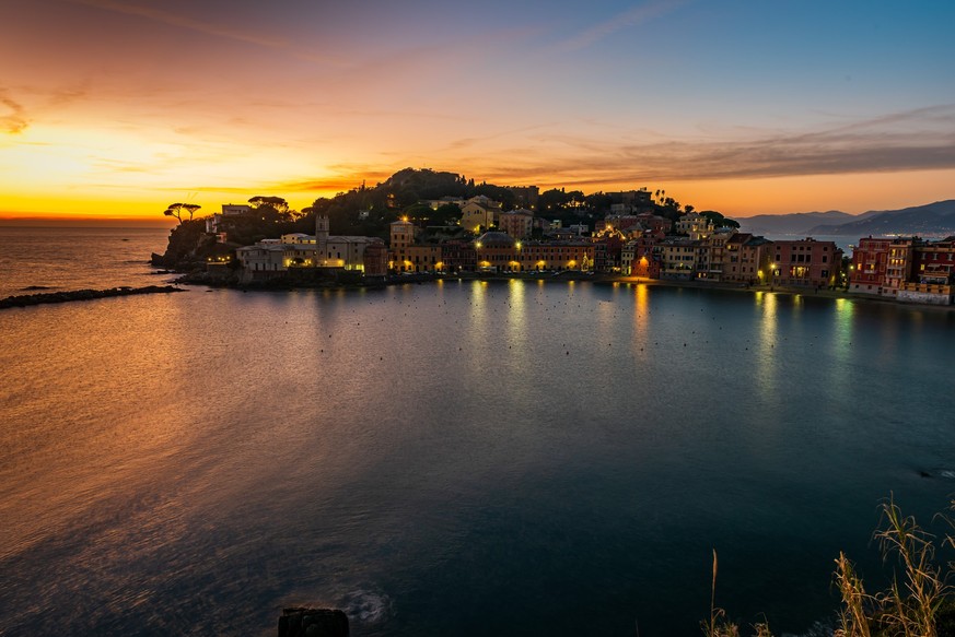 Sunset on the Baia del Silenzio in the fishing village of Sestri Levante, in the Italian Riviera xkwx baia del silenzio, cityscape, colorful, europe, european, famous place, hamlet, italian, italian r ...