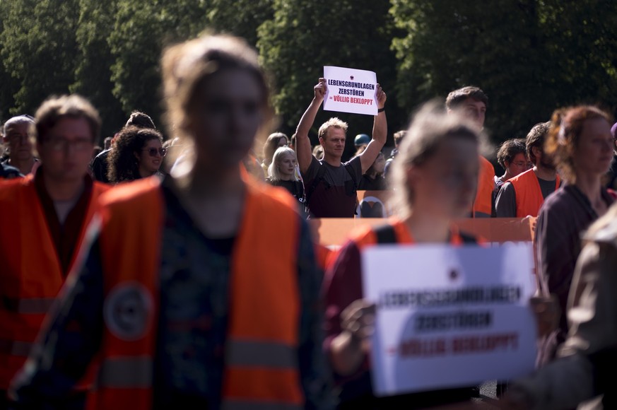 Protestors attend a demonstration of the climate protest group &#039;Letzte Generation&#039;, &#039;Last Generation&#039; in Berlin, Germany, Wednesday, May 24, 2023. Posters read: &#039;Destroy livel ...