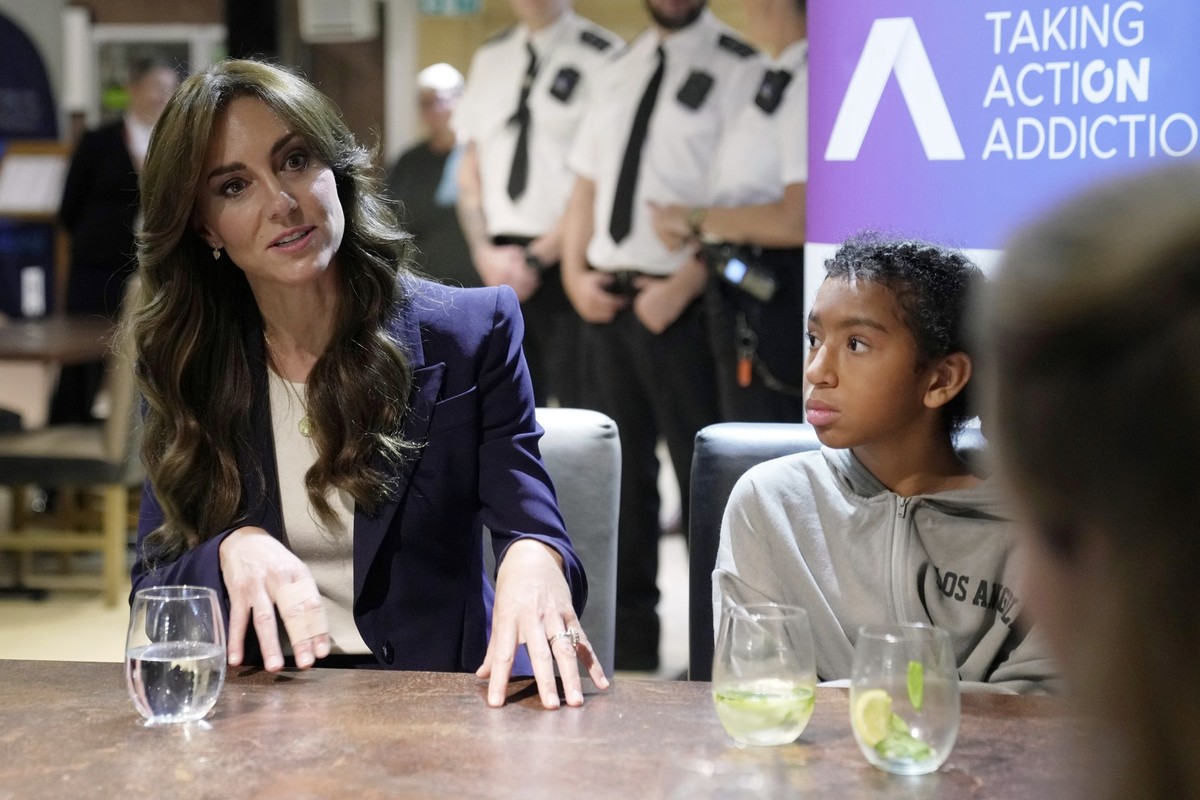 Britain&#039;s Kate, the Princess of Wales, Patron of The Forward Trust sits next to a visitor at HMP High Down in Sutton, England, Tuesday, Sept. 12, 2023, during a visit to learn about how the chari ...
