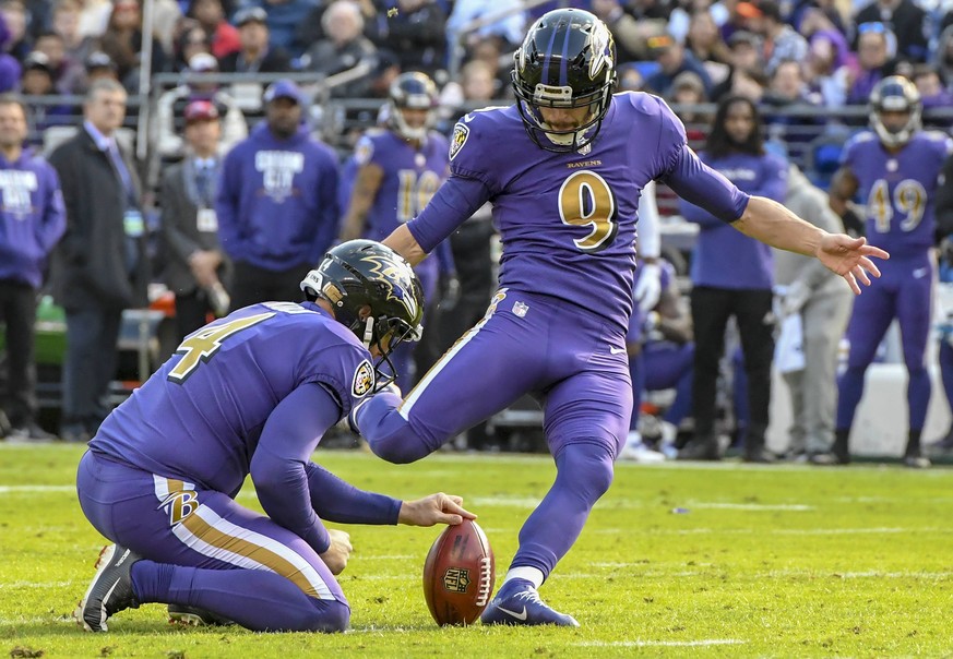 BALTIMORE, MD - NOVEMBER 25: Baltimore Ravens kicker Justin Tucker (9) kicks a field goal out of the hold of punter Sam Koch (4) against the Oakland Raiders on November 25, 2018, at M&amp;T Bank Stadi ...