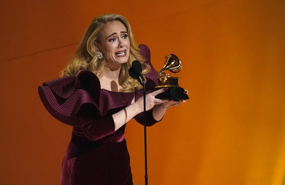 Adele accepts the award for best pop solo performance for &quot;Easy On Me&quot; at the 65th annual Grammy Awards on Sunday, Feb. 5, 2023, in Los Angeles. (AP Photo/Chris Pizzello)