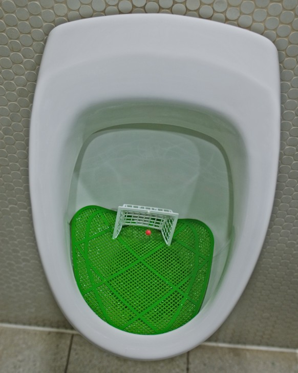 Football is everywhere. Urinal in german pub. Now it