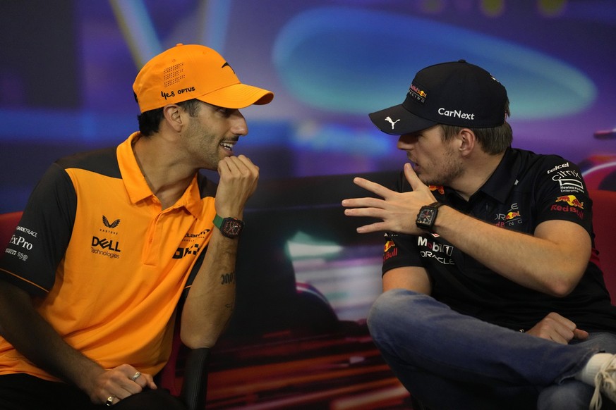 Red Bull driver Max Verstappen, right, speaks with McLaren driver Daniel Ricciardo, of Australia, of The Netherlands, during a press conference ahead of the Formula One Abu Dhabi Grand Prix, in Abu Dh ...