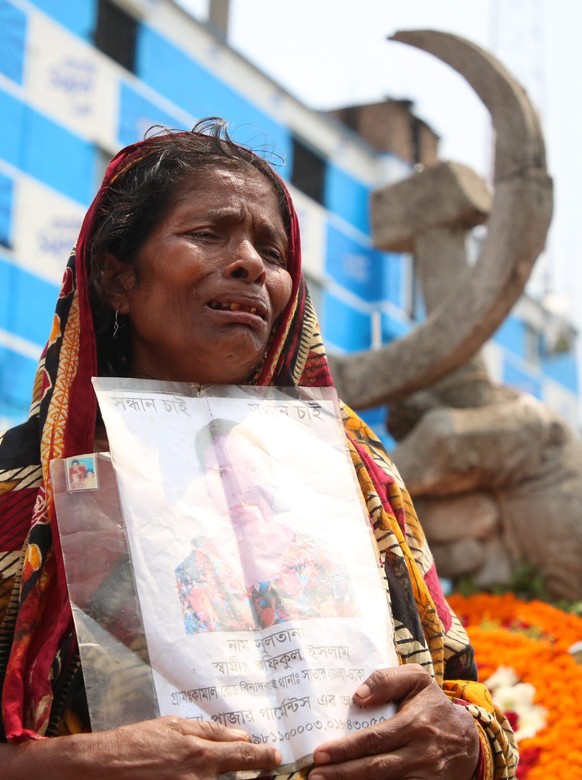 Activist and relatives of victims of the Rana Plaza disaster during a protest in 2019.