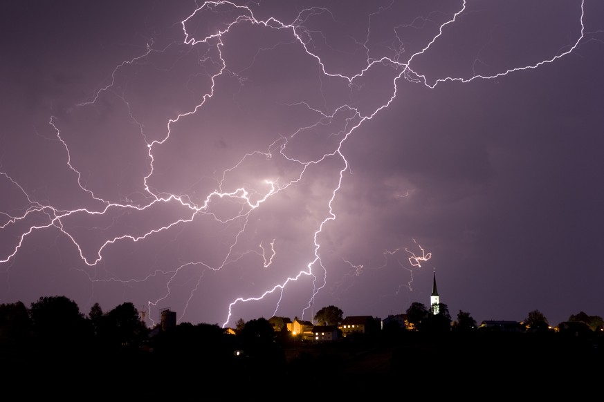 Storm and lightning over a little village.