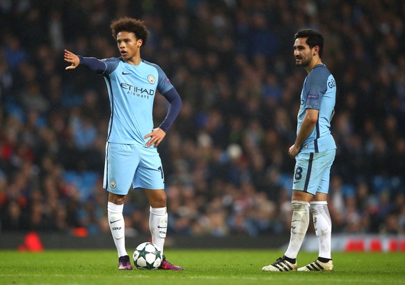 MANCHESTER, ENGLAND - DECEMBER 06: Leroy Sane of Manchester City (L) and Ilkay Gundogan of Manchester City (R) prepare to take a freekick during the UEFA Champions League Group C match between Manches ...