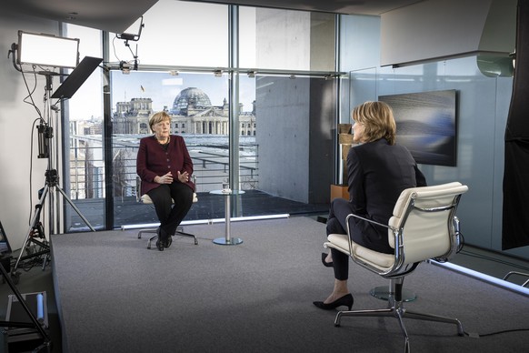 BERLIN, GERMANY - FEBRUARY 12: In this handout photo provided by the German Government Press Office (BPA) German Chancellor Angela Merkel and the presenter Marietta Slomka (R) during an interview for  ...