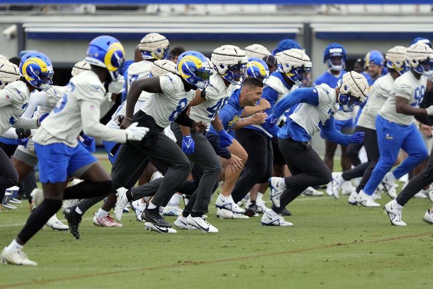 Members of the Los Angeles Rams runs sprints during the NFL football team&#039;s organized team activities Tuesday, May 23, 2023, in Thousand Oaks, Calif. (AP Photo/Marcio Jose Sanchez)