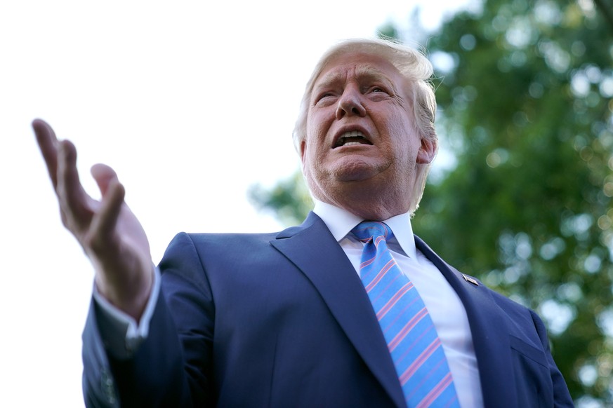 WASHINGTON, DC - AUGUST 02: U.S. President Donald Trump talks to journalists before boarding Marine One and departing the White House August 02, 2019 in Washington, DC. Trump is traveling to Bedminste ...