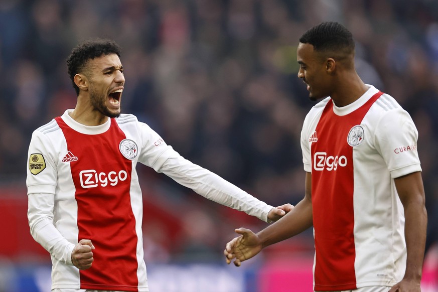 AMSTERDAM - lr Noussair Mazraoui of Ajax, Ryan Gravenberch or Ajax during the Dutch Eredivisie match between Ajax and Feyenoord at the Johan Cruijff ArenA on March 20, 2022 in Amsterdam, Netherlands.  ...