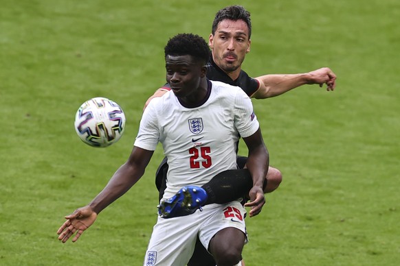 LONDON, UNITED KINGDOM - JUNE 29: Bukayo Saka (25) of England in action against Mats Hummels (5) of Germany during EURO 2020 Round of 16 match between England and Germany at Wembley Stadium in London, ...