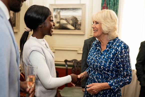 Royal reception for First Story charity Queen Camilla greets guest Daniella Koranteng during a reception at Clarence House, London, to celebrate the 15th anniversary of the First Story charity. First  ...