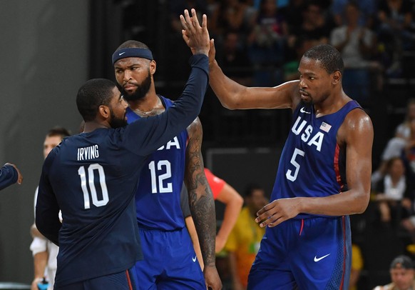 Kevin Durant and Kyrie Irving of the United States high five in the first half against Serbia in the Men s Basketball gold medal game between Serbia and the United States at Carioca Arena 1 at the 201 ...