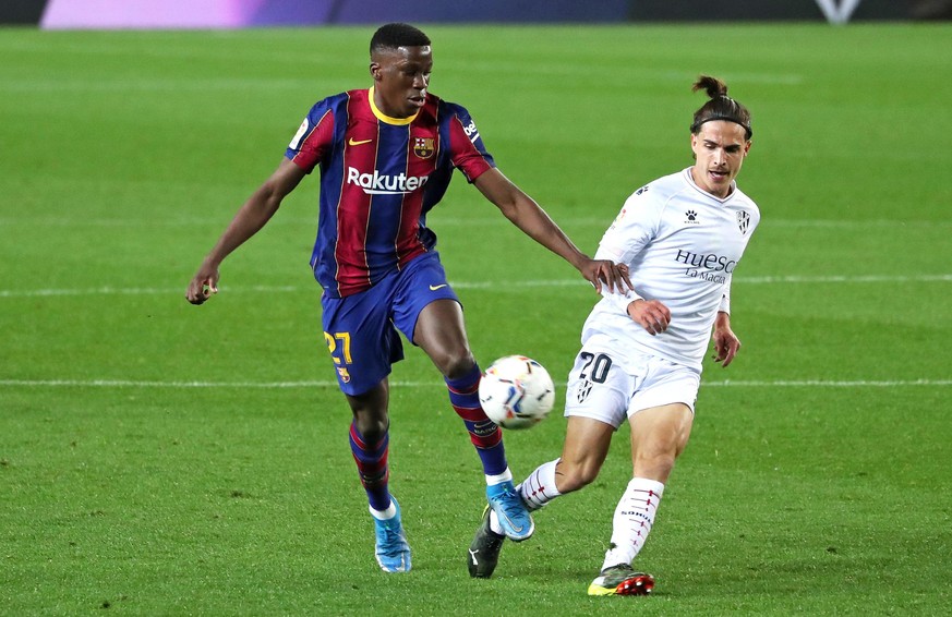 Ilaix Moriba and Jaime Seoane during the match between FC Barcelona and SD Huesca, corresponding to the week 27 of the Liga Santander, played at the Camp Nou Stadium, on 15th March 2021, in Barcelona, ...