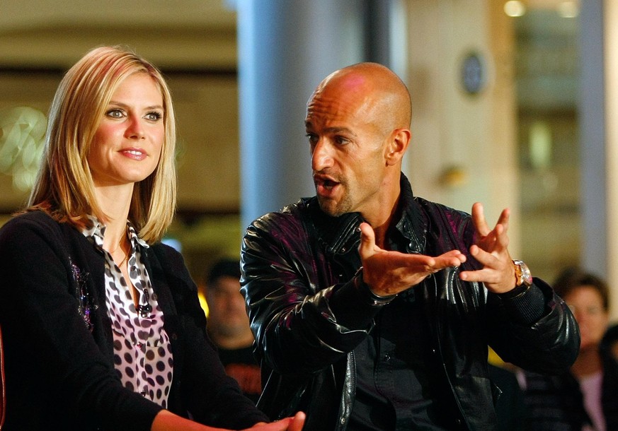 LAS VEGAS - JANUARY 24: Co-hosts and judges of &quot;Germany&#039;s Next Topmodel&quot; (L-R) Rolf Scheider, model Heidi Klum and Peyman Amin watch contestants put on a fashion show during a taping of ...