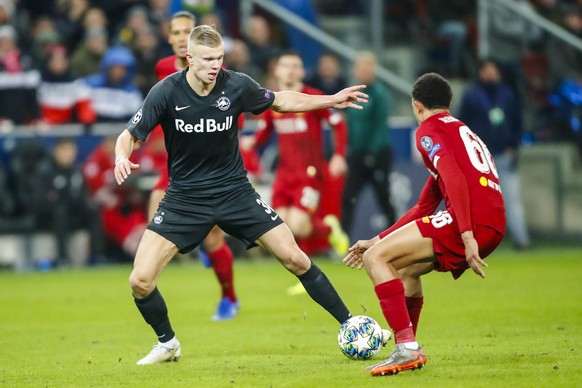 SOCCER - CL, RBS vs Liverpool SALZBURG,AUSTRIA,10.DEC.19 - SOCCER - UEFA Champions League, group stage, Red Bull Salzburg vs Liverpool FC. Image shows Erling Haaland RBS and Trent Alexander-Arnold Liv ...