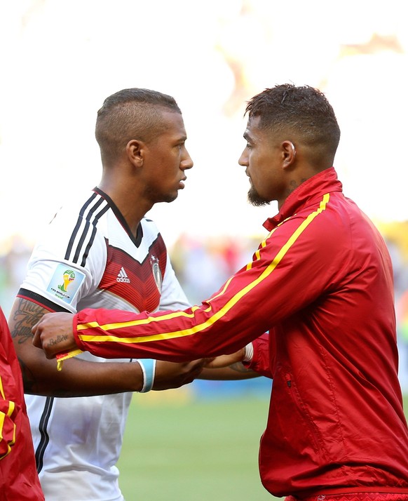 Germany s Jerome Boateng (L) talk s with Ghana s Kevin-Prince Boateng before a Group G match between Germany and Ghana of 2014 FIFA World Cup at the Estadio Castelao Stadium in Fortaleza, Brazil, June ...