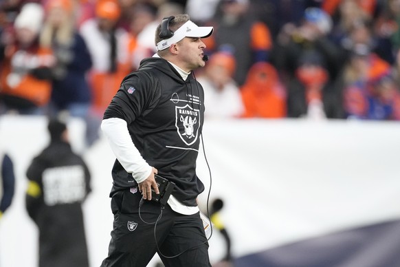 Las Vegas Raiders head coach Josh McDaniels walks onto the field during the second half of the team&#039;s NFL football game against the Denver Broncos in Denver, Sunday, Nov. 20, 2022. (AP Photo/Davi ...